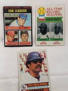 lot 63 image: Lot of 3 Vintage Cards Reggie Jackson 1979 Topps No. 700, Lou Brock 1979 Stolen Base Record No. 415, 1970 NL ERA Leaders Tom Seaver, Wayne Simpson, Luke Walker No. 68