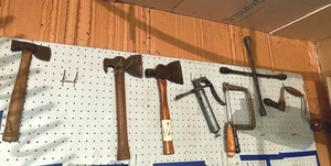 lot 46 image: Wall of Tools Lot - Hatchets, Saws, and More