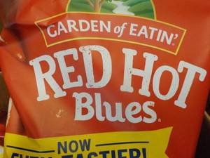 lot 406 image: Case of 12 bags Red Hot Blue Chips