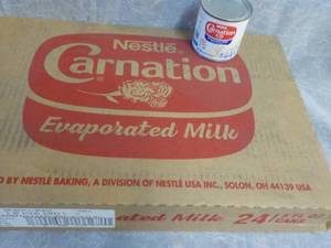 lot 71 image: Tray of 24 - 5 oz Cans Nestle Carna...