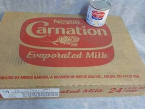 lot 73 image: Tray of 24 - 5 oz Cans Nestle Carna...