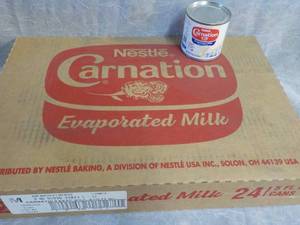 lot 74 image: Tray of 24 - 5 oz Cans Nestle Carna...