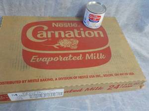lot 76 image: Tray of 24 - 5 oz Cans Nestle Carna...