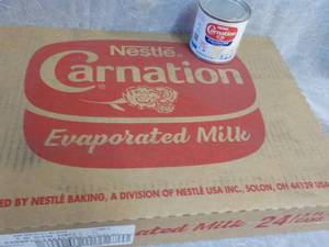 lot 77 image: Tray of 24 - 5 oz Cans Nestle Carna...