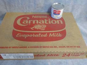 lot 79 image: Tray of 24 - 5 oz Cans Nestle Carna...