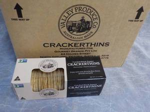 lot 96 image: Case of 12 Boxes Cracker Thins from...