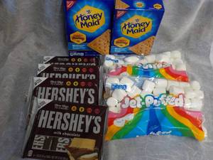 lot 155 image: Smores Kit- 2 Boxes Honey Maid Graham Crackers, 4 - 6 ct Hersheys Candy Bars and 2 - 12 bags Jet Puffed Marshmellows best date 8 and 92023