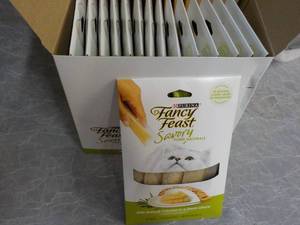 lot 177 image: Box of 15 Purina Fancy Feast Savory with Natural Chicken in a Demi Glace Cat Treats retail $3 each best date 082023