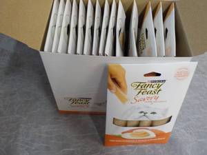 lot 187 image: Box of 15 Purina Fancy Feast Savory with Natural Salmon and Tune in a Demi Glace Cat Treats retail $3 each best date 082023