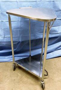 lot 9 image: MSRP $700 Pedigo Products Triangular Mobile Closed Lid Hamper - Stainless Steel Foot-Operated Linen Hamper with 18 Opening and Lid - Complete with Quiet-Close lid to help prevent lid from slamming and reducing odor - Great Condition