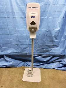 lot 17 image: MSRP $300 Purell Touch Free Automatic Hand Sanitizer Dispenser &amp Stand With Extra Bottle Of Sanitizer Great Working Condition
