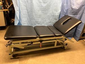 lot 24 image: WOW $$$$ Chattanooga TRE-24 Triton Powered Height Adjustable 4 Section Chiropractors Treatment Table With FootHand Remote Control - Excellent Working Condition