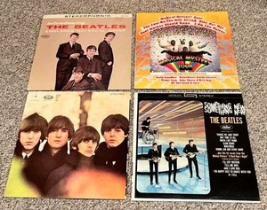 lot 23 image: Amazing Beatles Vinyl Records