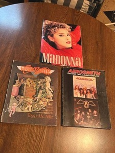 lot 48 image: Vintage Aerosmith Sheet Music Books and Madonna Magazine Poster Book