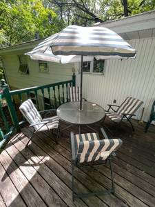 lot 86 image: Metal and Glass Patio Table w Chairs and Umbrella