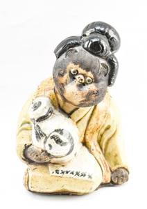 lot 44 image: Japanese Clothed Tanuki Pottery Statue