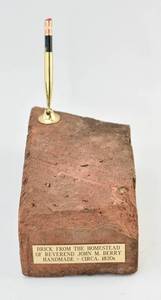 lot 186 image: Pen Rest Featuring a Brick from Reverend John Berrys Homestead