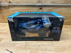 lot 37 image: SHARPER IMAGE RC- ALL-TERRAIN RACER STREET THRASHER