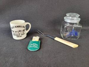 lot 77 image: Marigold Dairy Meat fork, Blue Earth County Candy Jar, Bretts Beauty Shop and Veterans Memorial Bridge Mug