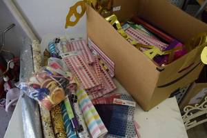 Large box full of wrapping paper,