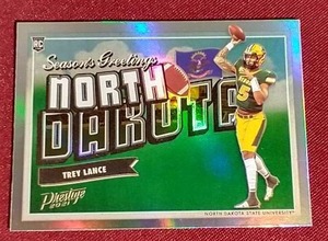 lot 64 image: 2021 Prestige Trey Lance Rookie Card - Awesome North Dakota Postcard