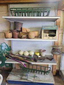 lot 7 image: Lot of Window Baskets, Aluminum Country Bell, Baskets, Watering Wands, Pot Brackets and More on (4) Shelves