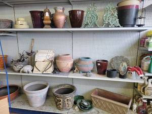lot 10 image: Lot of Decorative Pots, Ornate Garden Hose Holders, Dinner Bells and More on (6) Shelves