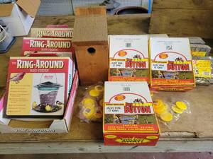 lot 15 image: (3) New Ring Around Bird Feeders, 250 Bug Buttons , Hanging Suets and More