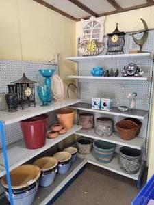 lot 32 image: (8) Shelves of Garden Decor, Clay Pots, Sundial and More