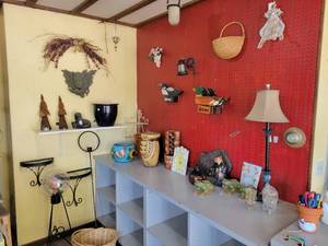 lot 33 image: Large Lot of Assorted Decor, Glass  Metal Wall Shelves, Pottery, Otter Fountain, Witch, Lamp and More