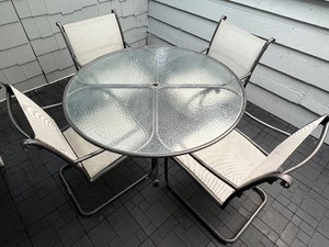 lot 24 image: Round Glass Top Patio Table and Four Chairs