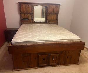 lot 110 image: Large Solid Wood King Size Water Bed Converted To Regular Mattress Bed With Two Drawer Side Table (Mattress Light Staining) (Bring Tools To Disassemble & Help TO Load)