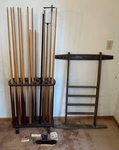lot 158 image: Group Of Misc. Pool Cues With Rolling Stand, Ball And Cue Wall Rack And Accessories