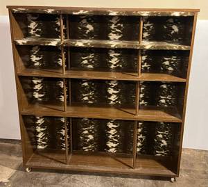lot 197 image: Vintage Wood Book Shelf With Faux Cow Fur Finish 50W x 51 12T x 11D On Wheels (BRING YOUR OWN HELP TO LOAD) IN BASEMENT