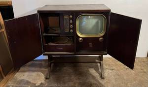 lot 202 image: 1950s Motorola TV Cabinet With AM-FM Radio & Record Player (Everything Seems To Work) (BRING YOUR OWN HELP TO LOAD) IN BASEMENT