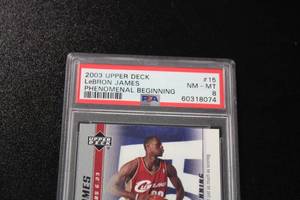 lot 110 image: 2003 Upper Deck Phenomenal Beginning LeBron James #15 PSA 8