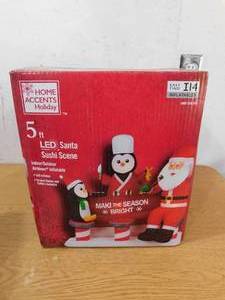 lot 225 image: Home Accents Holiday 5 ft LED Sushi Santa and Penguins Scene Holiday Inflatable