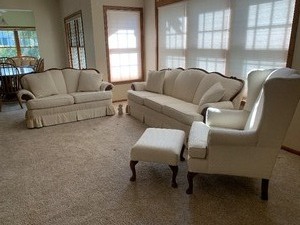lot 9 image: Sofa and Loveseat with Coordinating Wingback Chair and Ottoman