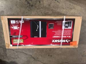 Husky Ready-to-Assemble 24-Gauge Steel Wall Mounted Garage Cabinet in Black (28 in. W x 29 in. H x 12 in. D)  Customer Returns See Pictures