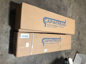 lot 10 image: Lot of Dark Brown Oak 47 in L x 12.15 in W x 2.28 in T Stair Tread Cover Adhesive by Cap A Tread Customer Returns See Pictures