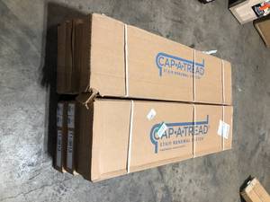 lot 12 image: 8 Boxes of Cap A Tread Essential OakGolden Rustic OakNobelford Oak 47 in. L x 12.15 in. W x 1.69 in. T Vinyl Stair Tread Cover Adhesive Customer Returns See Pictures