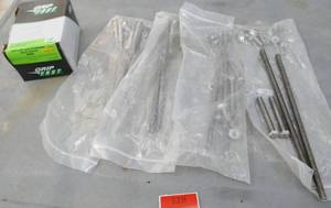 lot 128 image: Unopened 5lb box 30d 4-12 inch nails and 4 packages of threaded rod and bolts