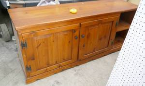 lot 138 image: Wood cabinet on wheels 60 wide x 18 deep x 25 tall