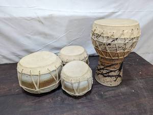 lot 76 image: Set Of Leather Hide Hand Drums With Ceramic Bases