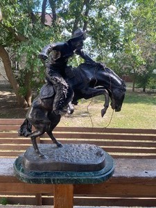 lot 4 image: Large Bronze Frederic Remington Bronco Buster Sculpture