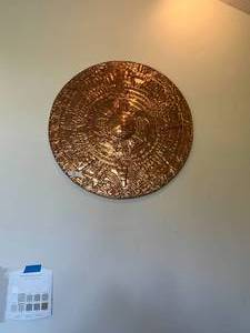 lot 35 image: Beautiful Aztec inspired wall hanging 36 copper colored