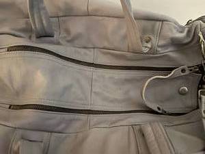 lot 143 image: All leather duffle set