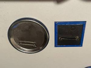 lot 242 image: Two vintage mac tonight pins