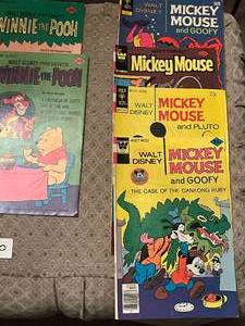 lot 350 image: 21 early 1970s- to early 1980s Disney Comic Books, Mickey, Scamp, Winnie the Pooh and more.