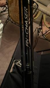 lot 372 image: Fire wood rack and fishing poles
